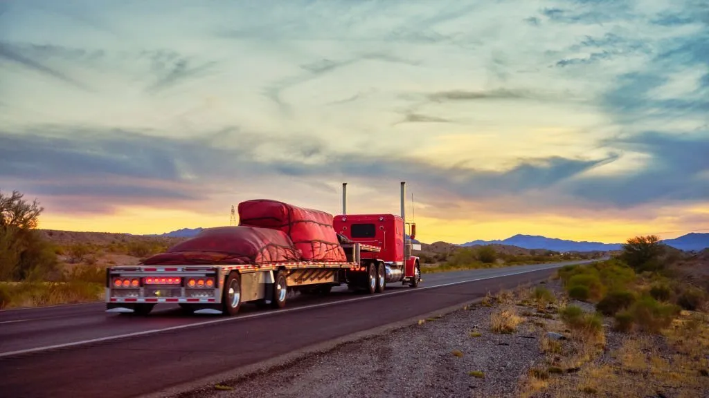 red Flatbed Trailers on a highway