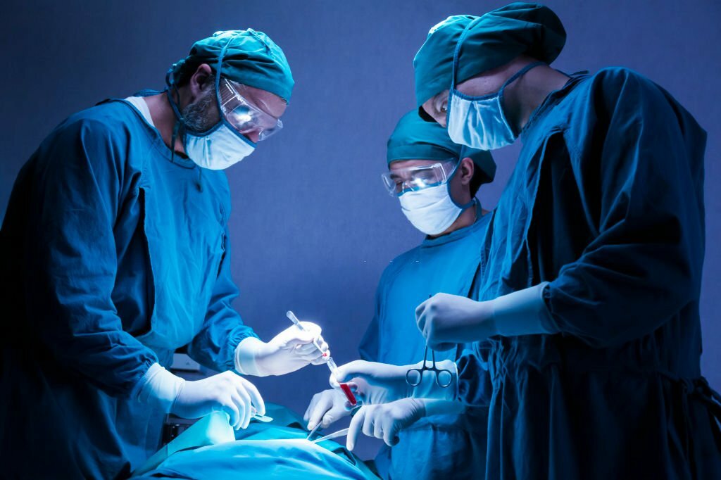A dedicated team of skilled surgical doctors is performing a procedure on a patient in the hospital's operating room. This scene embodies the essence of healthcare and medical expertise.