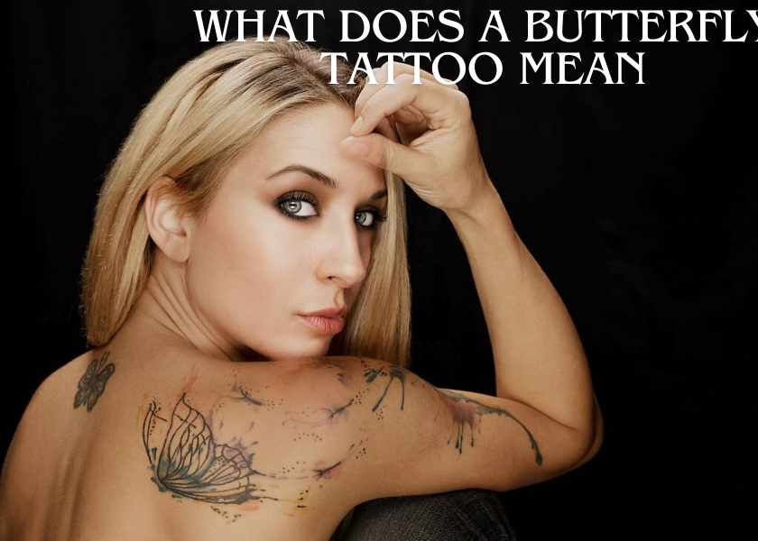 a women with black background and showing butterfly tatoo on her body and written What Does a Butterfly Tattoo Mean in White color
