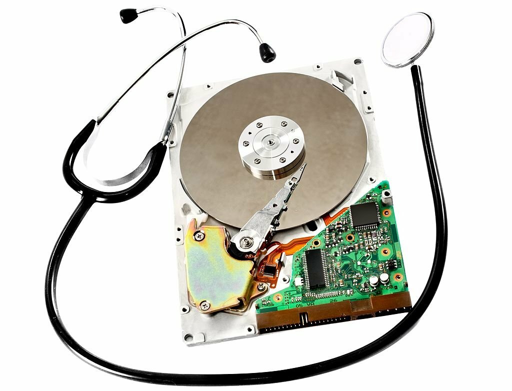 Close-up of an open large hard disk and a stethoscope, raw workflow, low sharpening, Isolated on white
